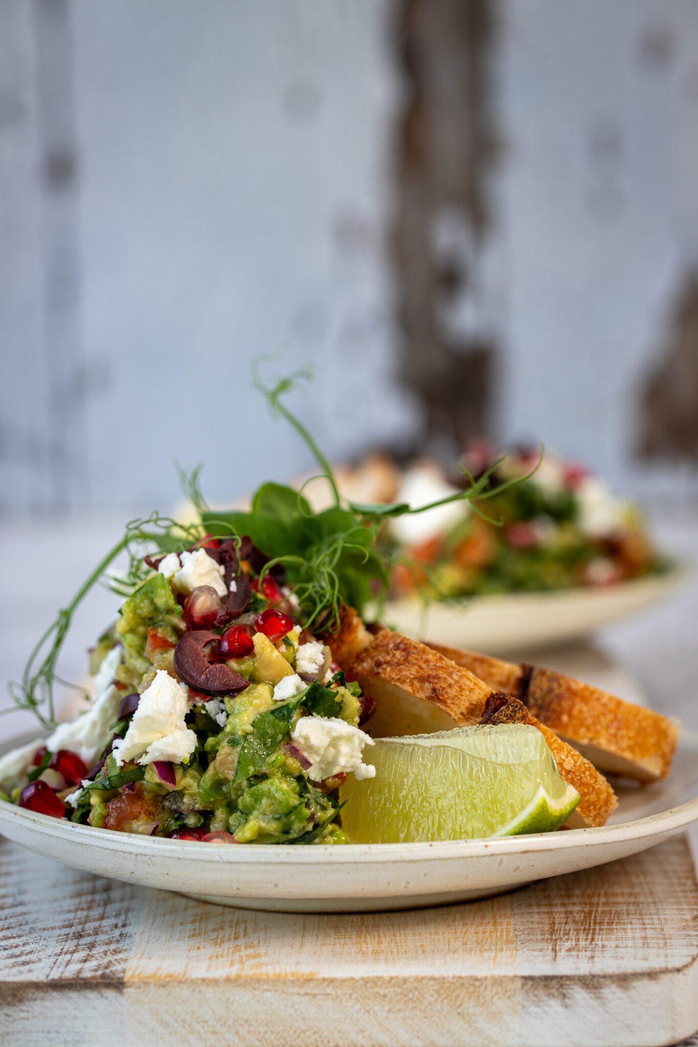 Spinach Guacamole with Feta, Pomegranate & Olive Crumble